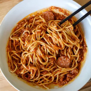 Spaghetti with ground beef and sausage links