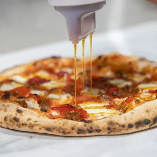 Drizzling some Mike's Hot Honey