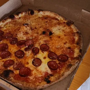 a pepperoni pizza in a box