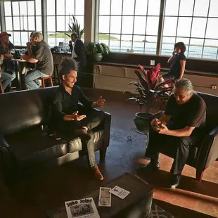 Our comfy leather sofas and chairs make up our &quot;living room&quot; area.