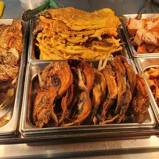 Left to right - tilapia, tortang talong (eggplant omelette), bangus (milkfish), lechon kuwali (pork belly), lumpia Shanghai