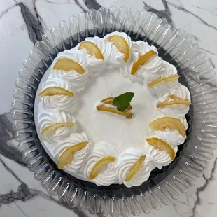 a pie with lemons and whipped cream