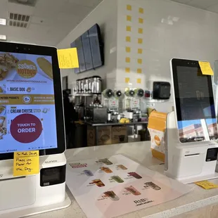 a tablet and a phone on a counter