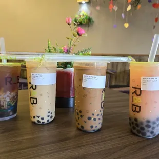 Peach black tea w/ adds, House milk tea w/ boba, Vietnamese coffee w/ 2x boba, Strawberry Yakult w/ 2x boba.