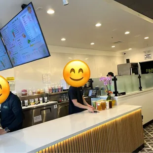 Workers busily making boba and not needing to interact with customers.