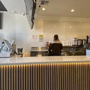 a woman sitting at a counter