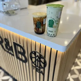 two cups of coffee on a counter