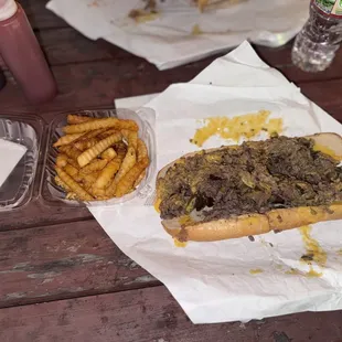 Philly Cheesesteak (double meat) with cheese whiz, onions, peppers and mushrooms and side of crinkle fries