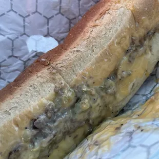 Philly cheesesteak sandwich with all three cheeses and onions,peppers and jalapeños !!!