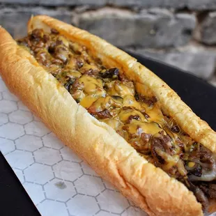 Cheesesteak with melted whiz cheese - made with grilled ribeye on a 10" Amoroso roll (from Philly bakery).