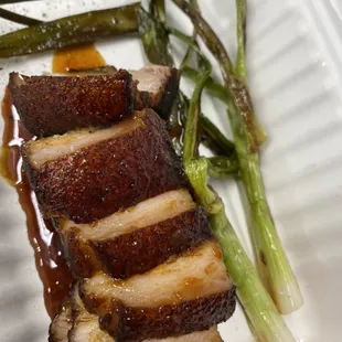 Pork belly with soy-lime reduction and grilled scallions