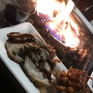 a plate of food and a glass of wine