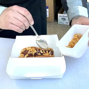 a man eating a dog