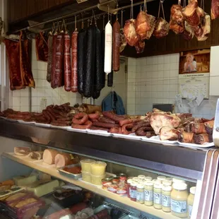 a display of sausages and meats