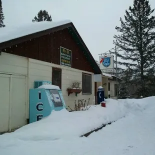 a parking meter in the snow