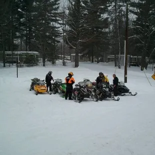 a group of snowmobilers