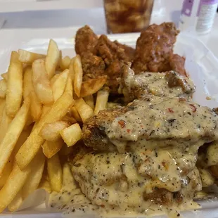 Garlic parmesan and spicy garlic breaded traditional wings and fries.