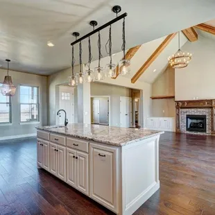 a spacious kitchen with a fireplace