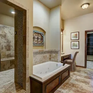 a large bathroom with a jacuzzi tub