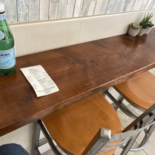 a table with a bottle of water on it