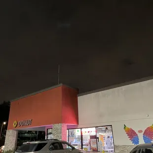 NEXT DOOR to the donut shop! I did 2 laps in the parking lot and almost missed it.