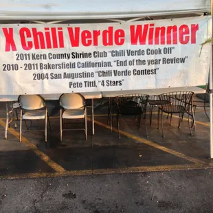 a sign for a chili verde winner