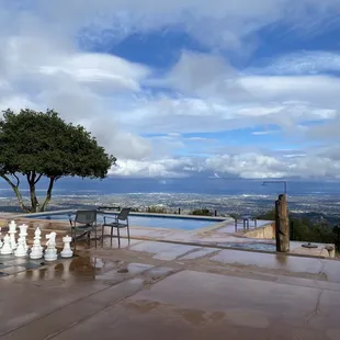 a view of a pool and chess set