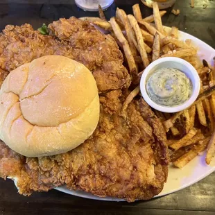 Fried chicken thigh sandwich and garlic fries.