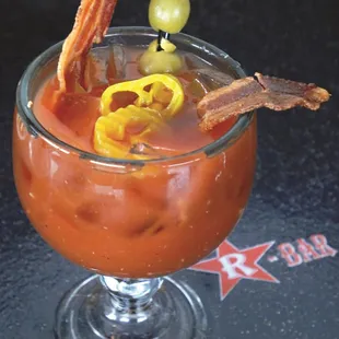 a bloody drink with bacon