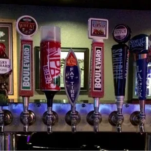 a row of beer taps