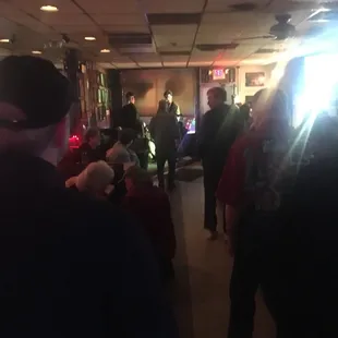 a crowd of people in a bar