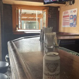 a can of beer on the bar