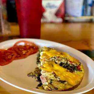 Omelet with sliced tomatoes