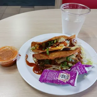 2 beef tacos for $3, salsa cup, and taco sauce packets