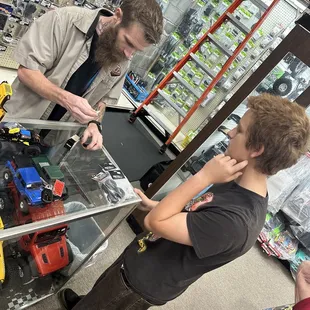 DJ educating my nephew on the best parts for his new toy. This was so awesome. Can't get this on Amazon - thank you DJ !