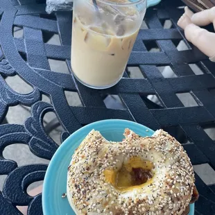 We love this place!! Featured is a bacon egg and cheddar bagel with a cold brew and baileys!!   Highly recommend!!