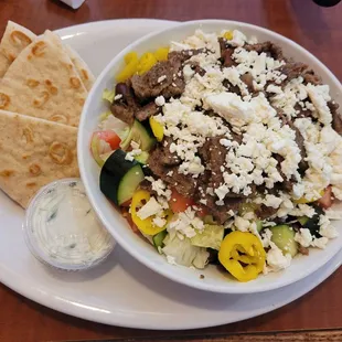 Gyro rice bowl with pita bread and tzatziki sauce