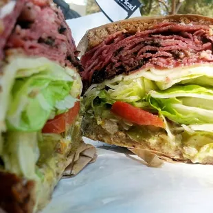 Hot Pastrami on toasted Rye, melted Muenster Cheese, Garlic Aioli, extra Pickles.
