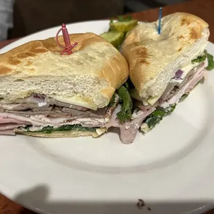 Smoked Submarine with ham, turkey and brisket with pepper jack cheese, lettuce, tomato and red onion and their special sauce.