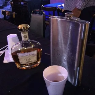 a flask and a shot glass