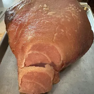 a ham on a baking sheet