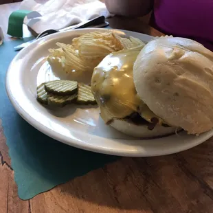 a sandwich and chips on a plate