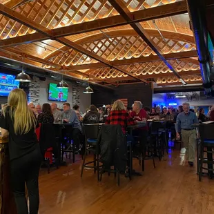 Front bar area with high top and very high ceilings