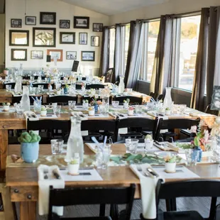 a long dining room with tables and chairs