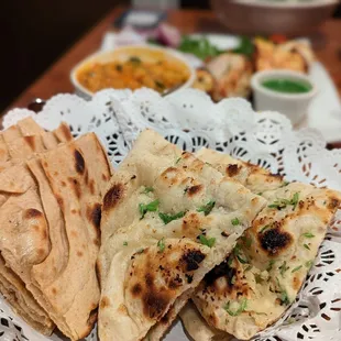 a plate of flatbreads and a bowl of soup