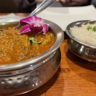 a bowl of curry and a bowl of rice