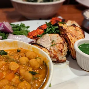 a plate of food with a bowl of soup