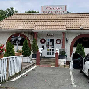 a car parked in front of the restaurant