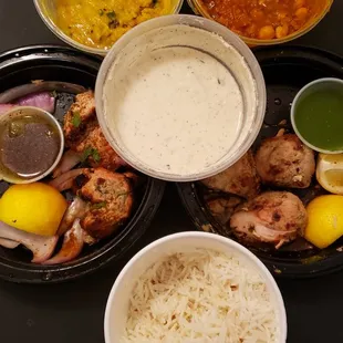 Grilled Chicken, Reshmi Kabob, Basmati Cumin Rice, Yogurt, yellow lentils, Chickpeas.  All half eaten! Super hungry while taking pics!