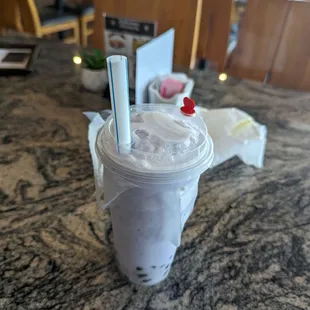 a smoothie in a plastic cup